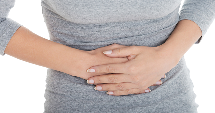 Stock image of a woman holding her stock with both hands